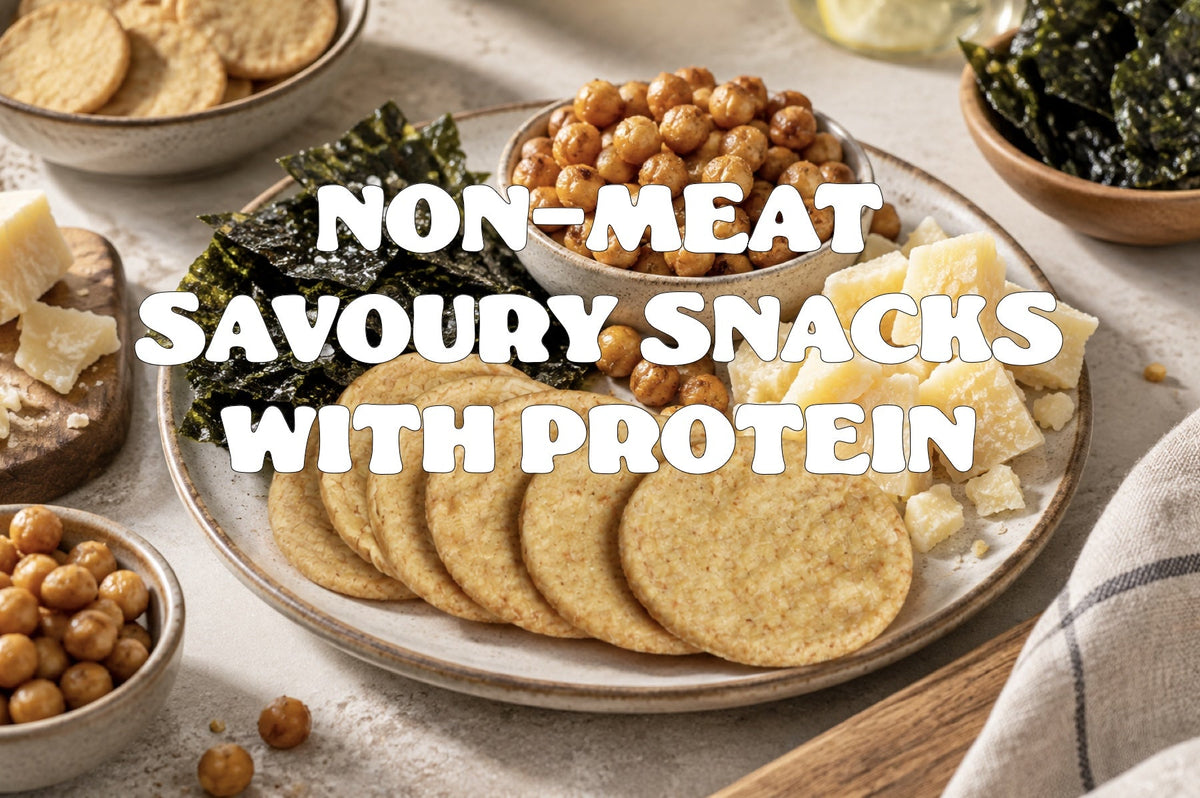 a plate of tempeh crisps with crispy chickpeas, seaweed sheets and chunks of hard cheese.