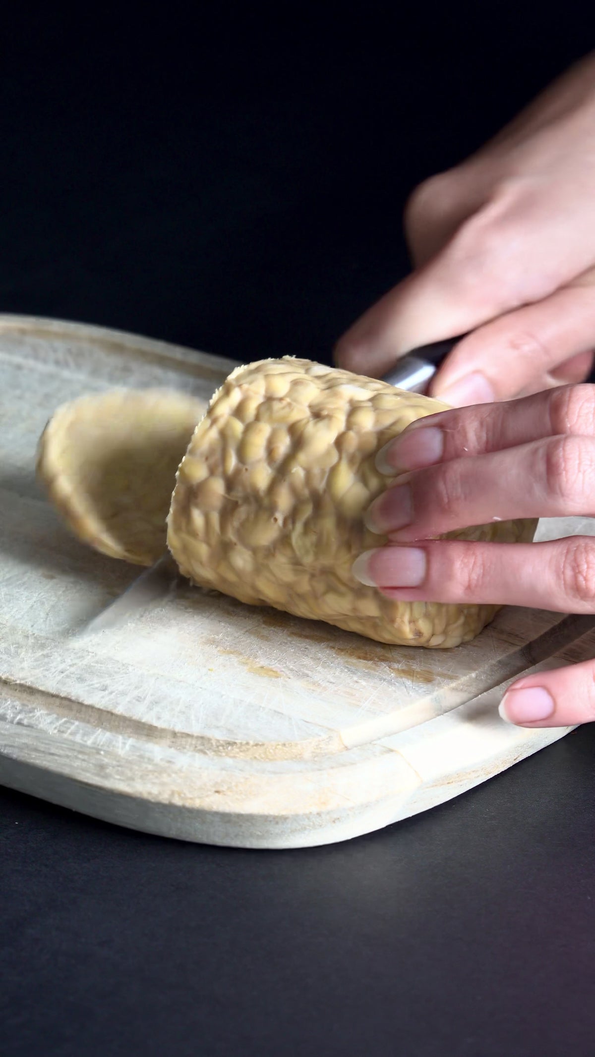 slicing tempeh block